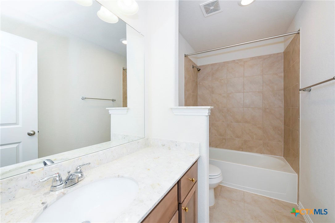 2069 Flametree Avenue New Braunfels, TX 78132 - Photo 31 of 46 a bathroom with a bathtub and a sink