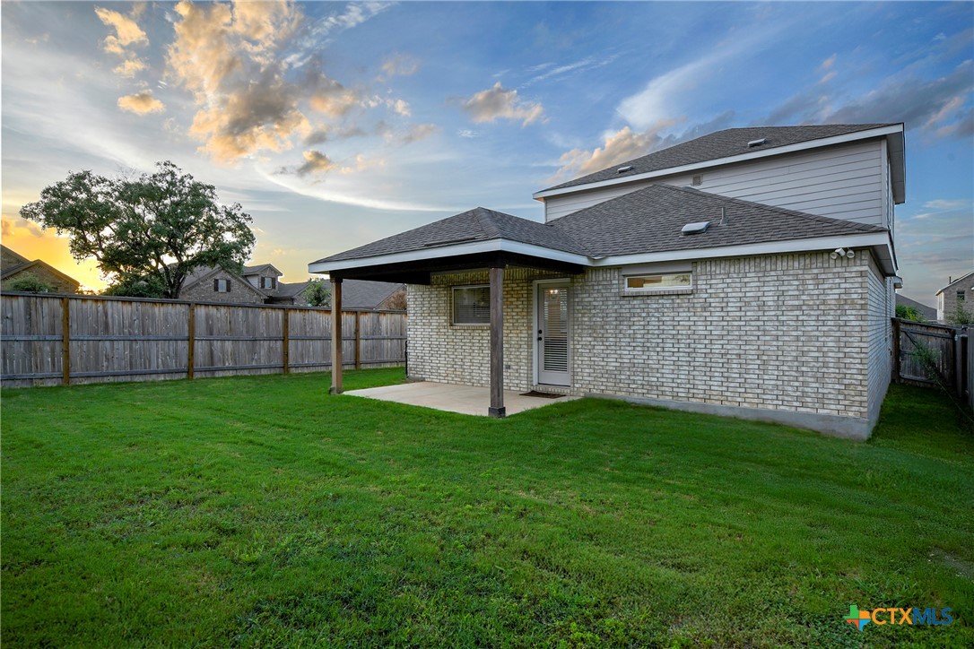 2069 Flametree Avenue New Braunfels, TX 78132 - Photo 32 of 46 a front view of a house with a garden