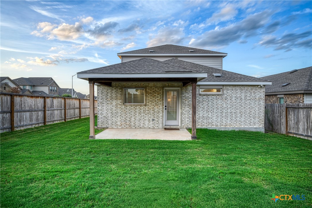 2069 Flametree Avenue New Braunfels, TX 78132 - Photo 36 of 46 a front view of a house with a yard
