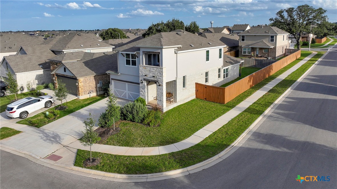 2069 Flametree Avenue New Braunfels, TX 78132 - Photo 5 of 46 an aerial view of a house with a garden and plants
