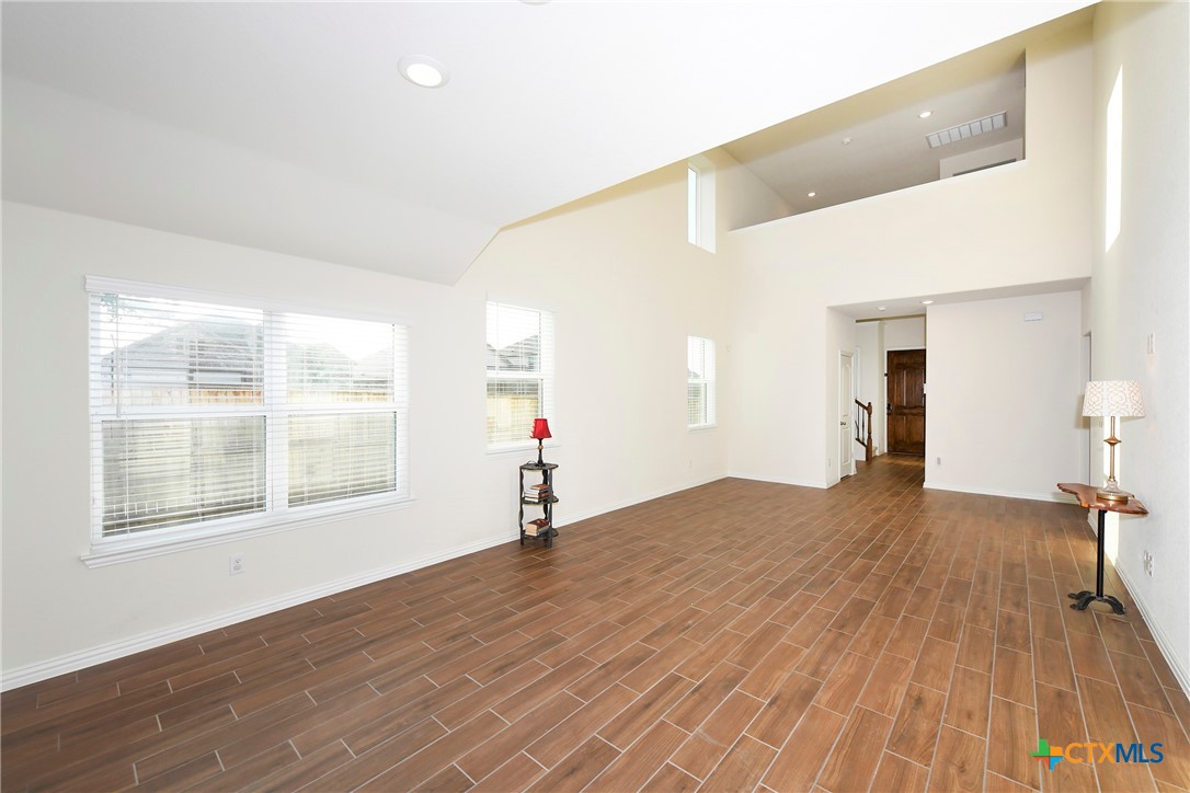 2069 Flametree Avenue New Braunfels, TX 78132 - Photo 10 of 46 a view of empty room with wooden floor and fan