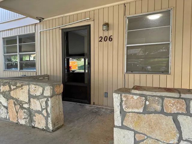 a bathroom with a tub and a window