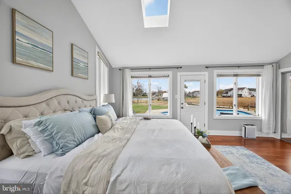 a bedroom with a bed and a desk