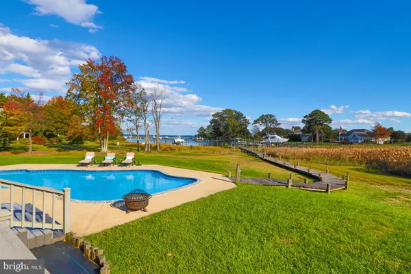 an aerial view of a house with a swimming pool