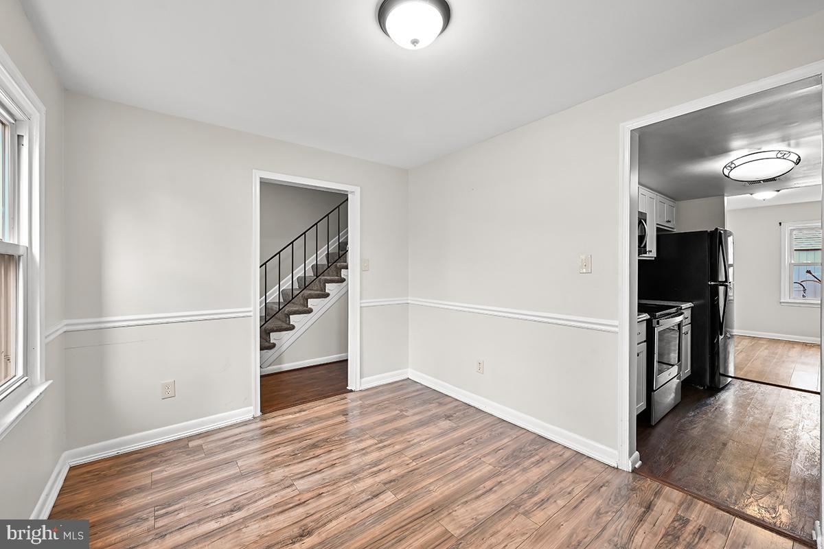 124 Marlow Street Southwest Leesburg, VA 20175 - Photo 13 of 37 a view of a room with wooden floor and electronic appliances