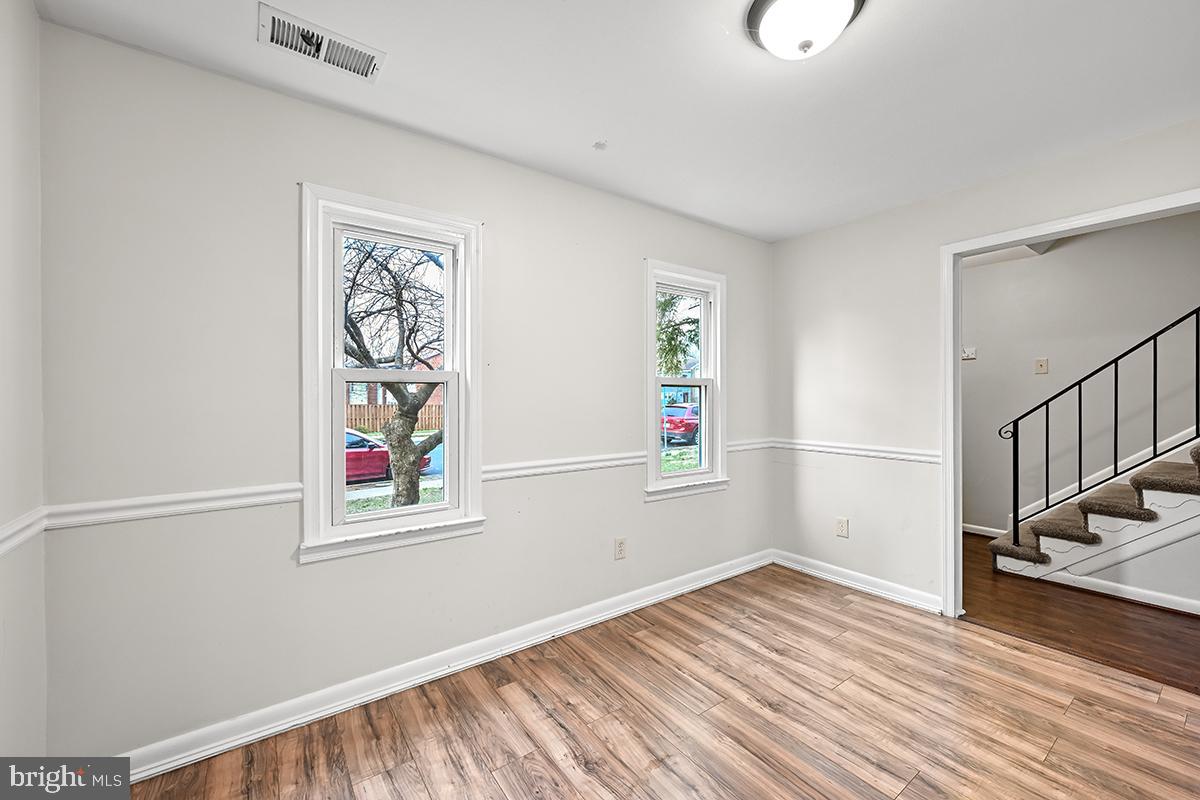 124 Marlow Street Southwest Leesburg, VA 20175 - Photo 14 of 37 a view of a hallway with wooden floor and a window
