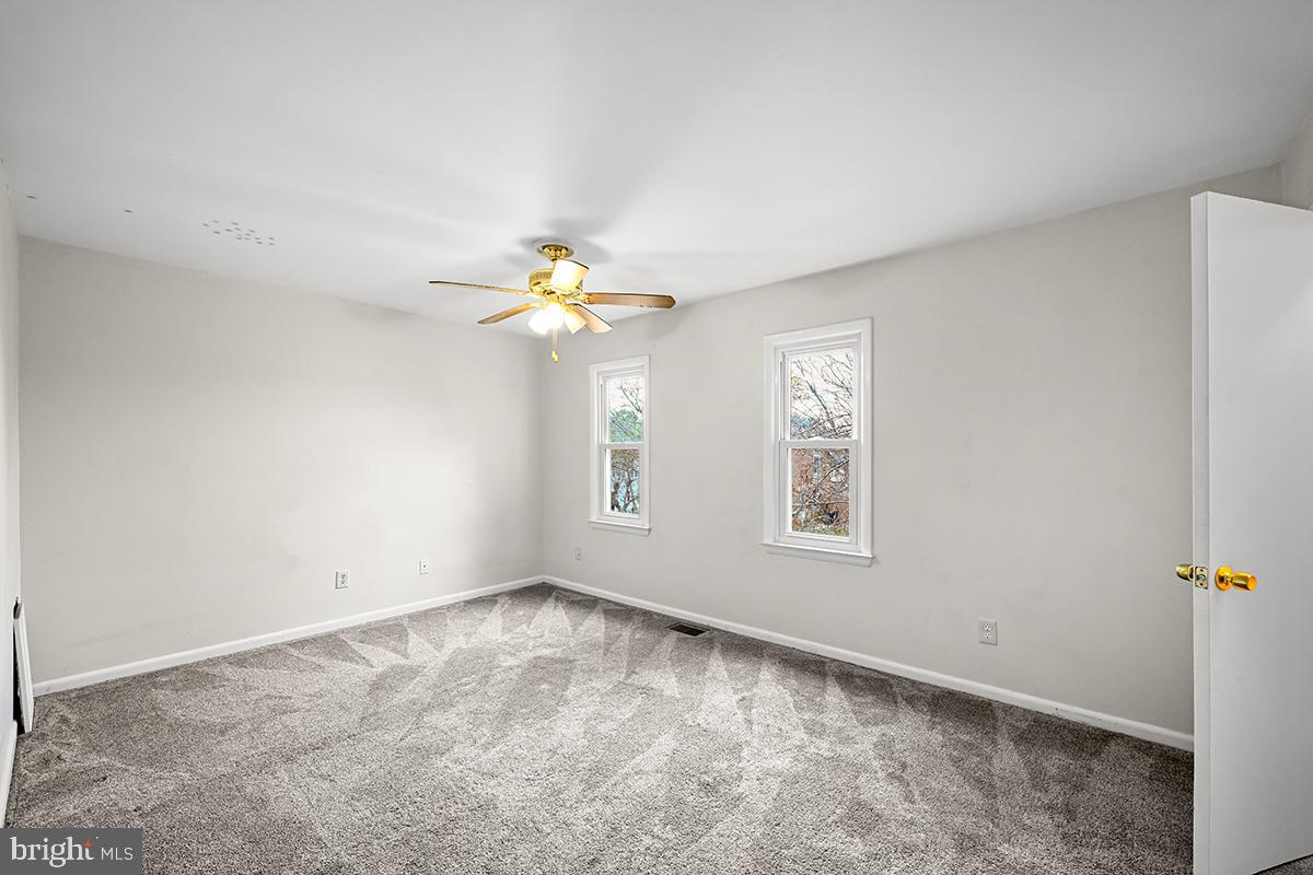 124 Marlow Street Southwest Leesburg, VA 20175 - Photo 25 of 37 a view of an empty room with a window