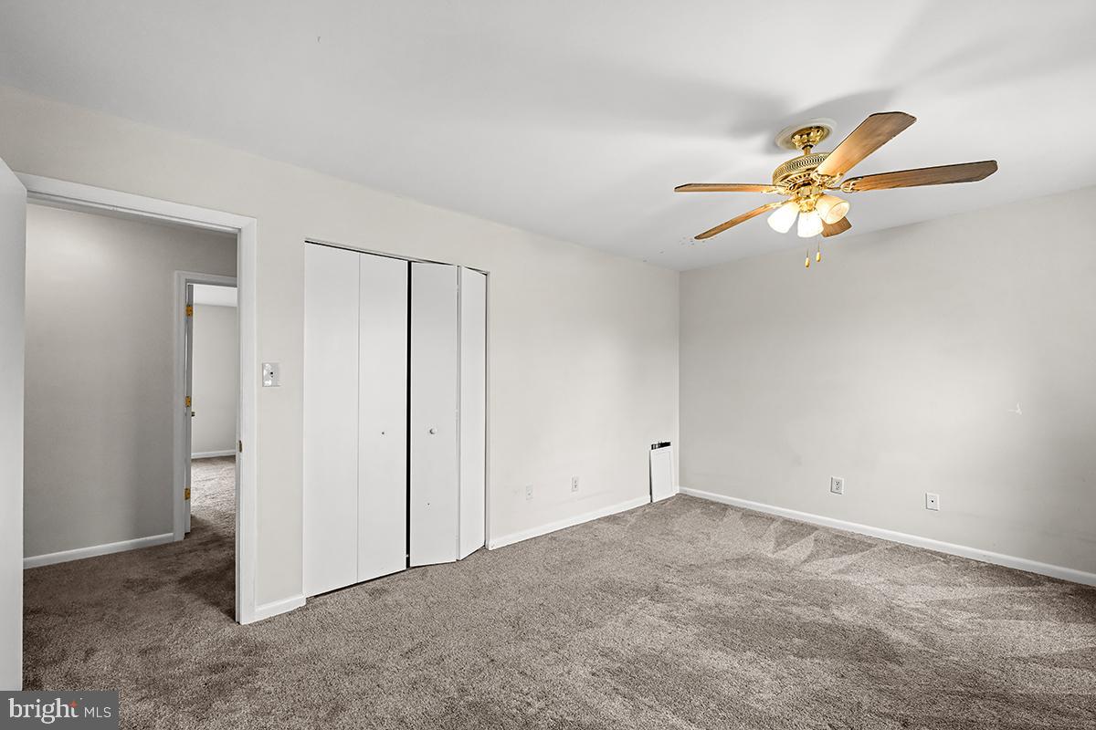 124 Marlow Street Southwest Leesburg, VA 20175 - Photo 26 of 37 an empty room with closet and a chandelier fan