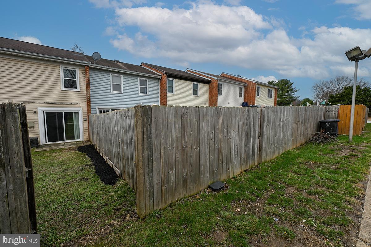 124 Marlow Street Southwest Leesburg, VA 20175 - Photo 35 of 37 a backyard of a house with wooden fence
