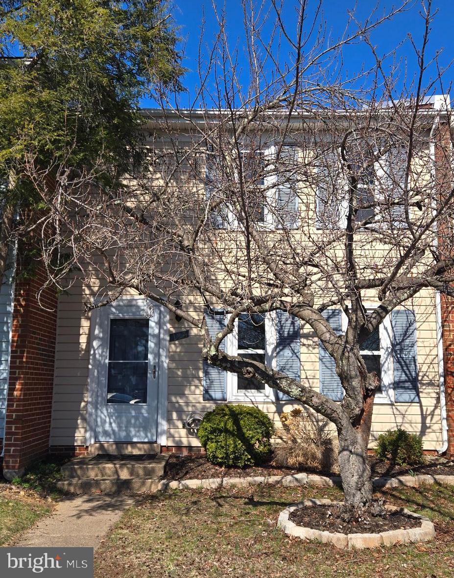 124 Marlow Street Southwest Leesburg, VA 20175 - Photo 37 of 37 a view of a stone house with large tree