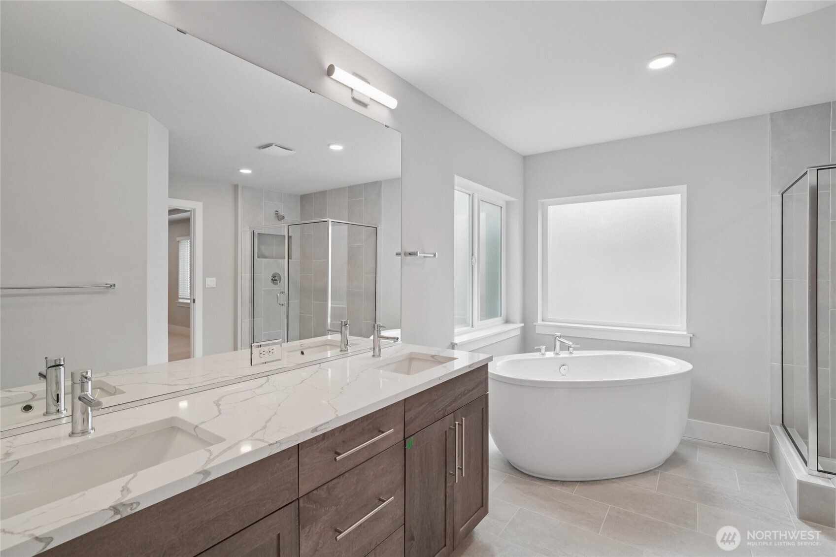 3822 194th Street Southeast Bothell, WA 98012 - Photo 24 of 29 a spacious bathroom with a double vanity sink mirror and bathtub