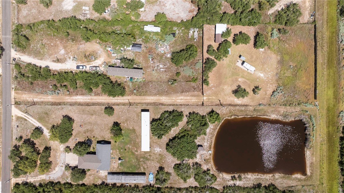 908 Jacoby Lane Aransas Pass, TX 78336 - Photo 13 of 27 a picture of a bathroom with a sink and mirror