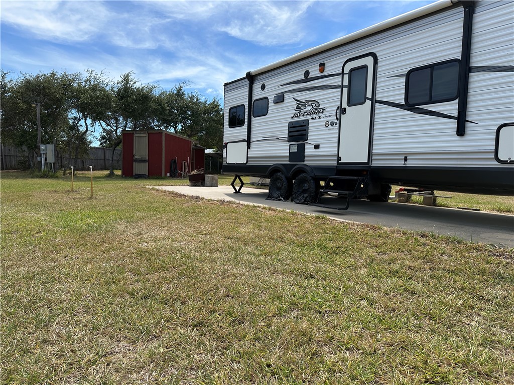 908 Jacoby Lane Aransas Pass, TX 78336 - Photo 14 of 27 a view of a house with a backyard