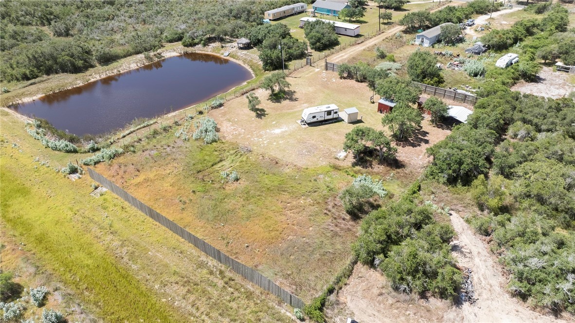 908 Jacoby Lane Aransas Pass, TX 78336 - Photo 6 of 27 a view of swimming pool from a lake