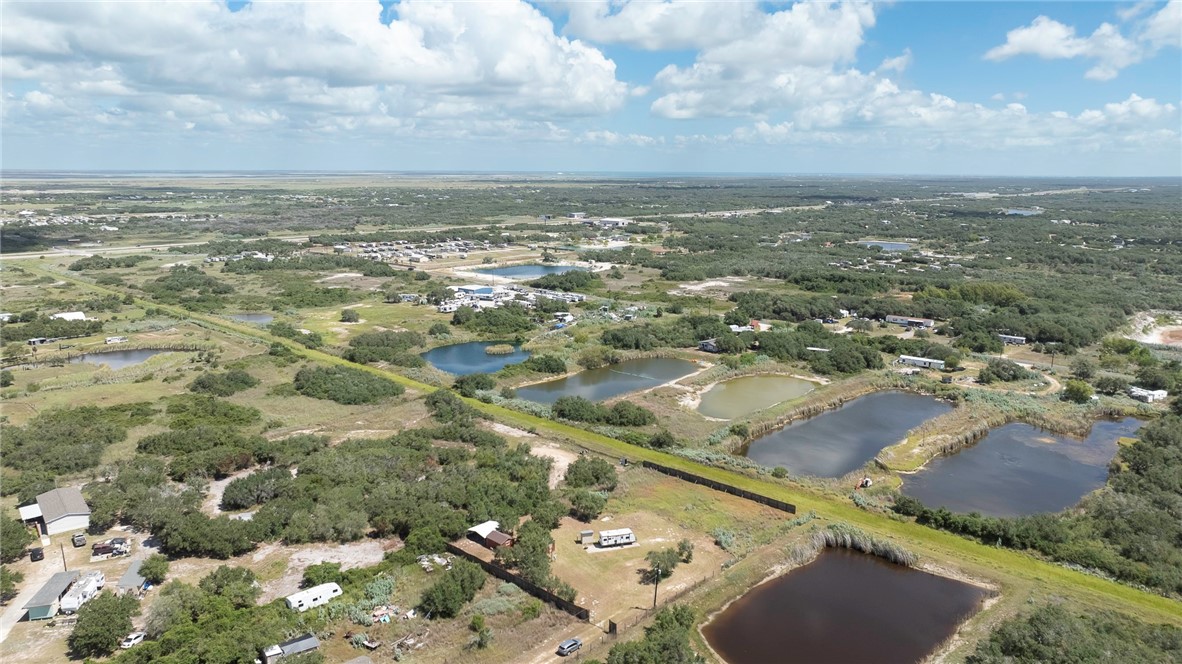 908 Jacoby Lane Aransas Pass, TX 78336 - Photo 9 of 27 an aerial view of residential building and lake