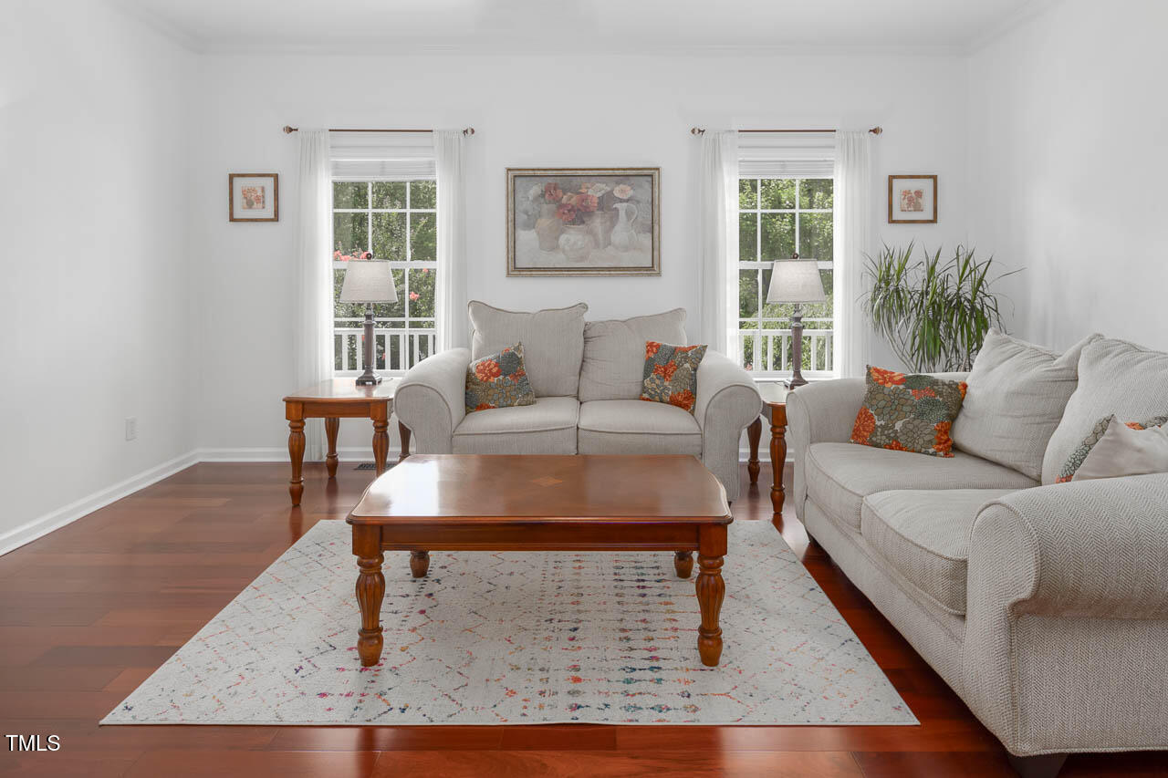 1059 Torrence Drive Apex, NC 27502 - Photo 13 of 49 a living room with furniture lamp and window