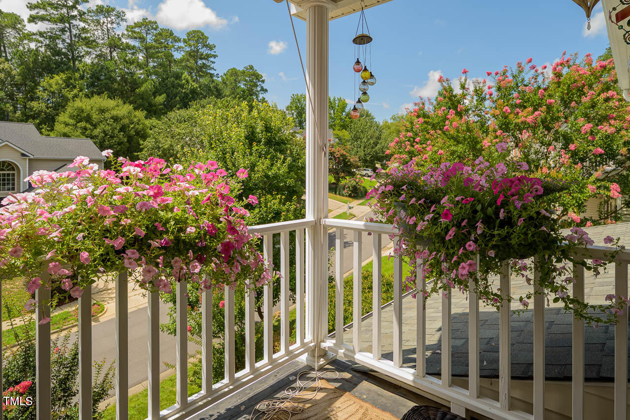 1059 Torrence Drive Apex, NC 27502 - Photo 19 of 49 a view of a house with a flower garden