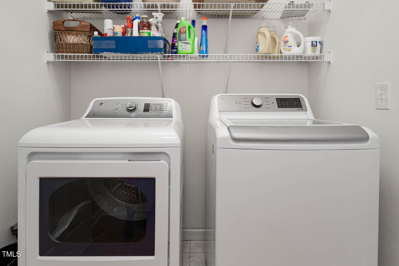 1059 Torrence Drive Apex, NC 27502 - Photo 33 of 49 a utility room with dryer and washer