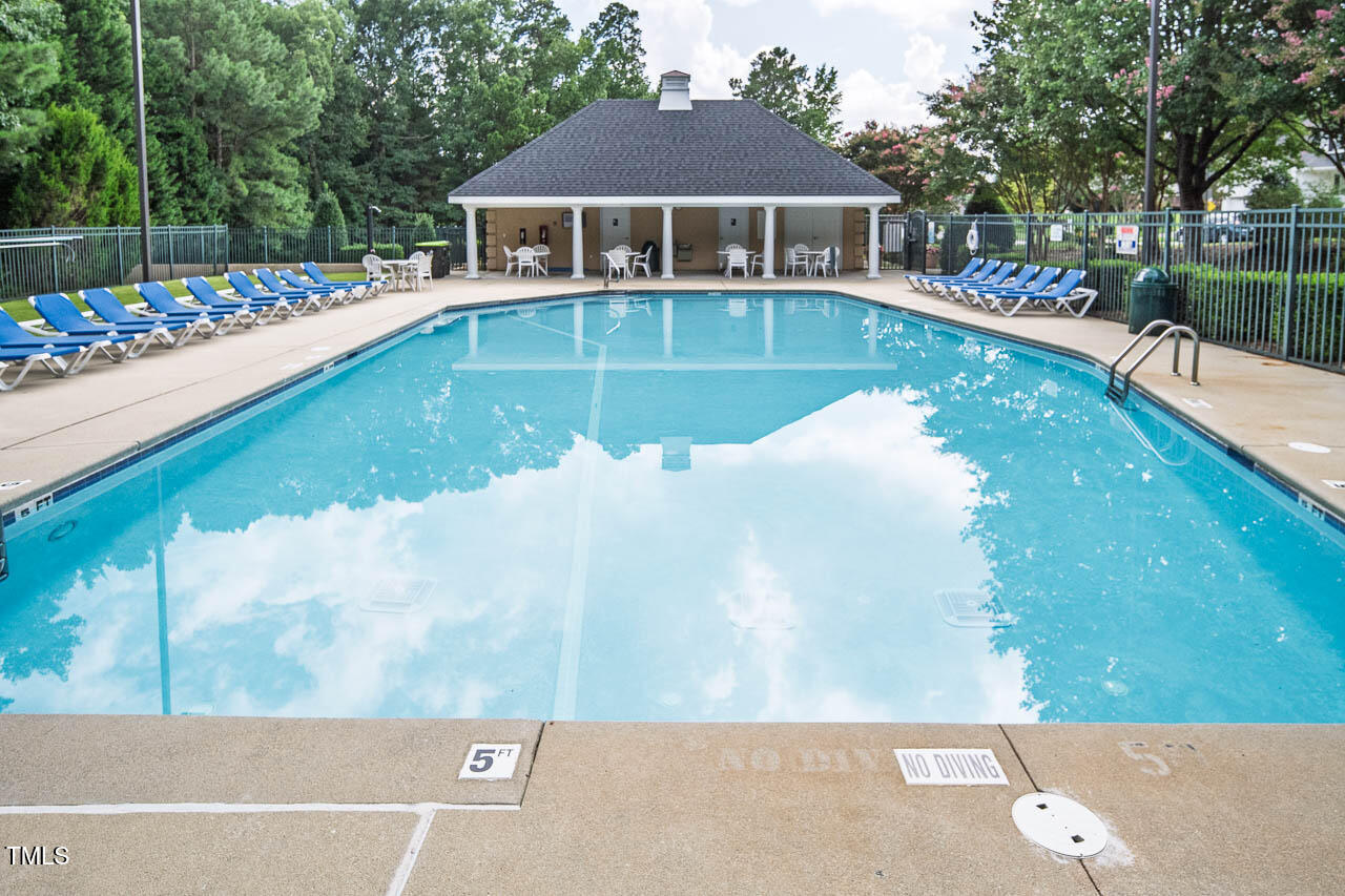 1059 Torrence Drive Apex, NC 27502 - Photo 43 of 49 a view of a house with swimming pool