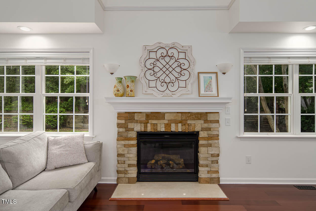 1059 Torrence Drive Apex, NC 27502 - Photo 9 of 49 a living room with furniture and a fireplace