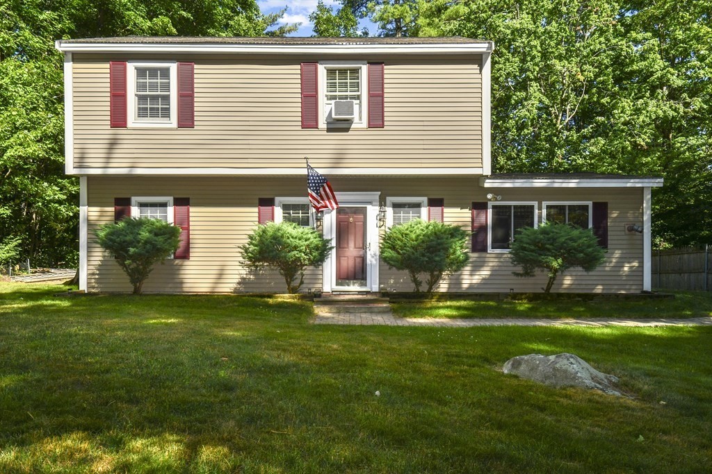 146 South Row Road Lunenburg, MA 01462 - Photo 1 of 32 a house that has a big yard with potted plants and a large tree