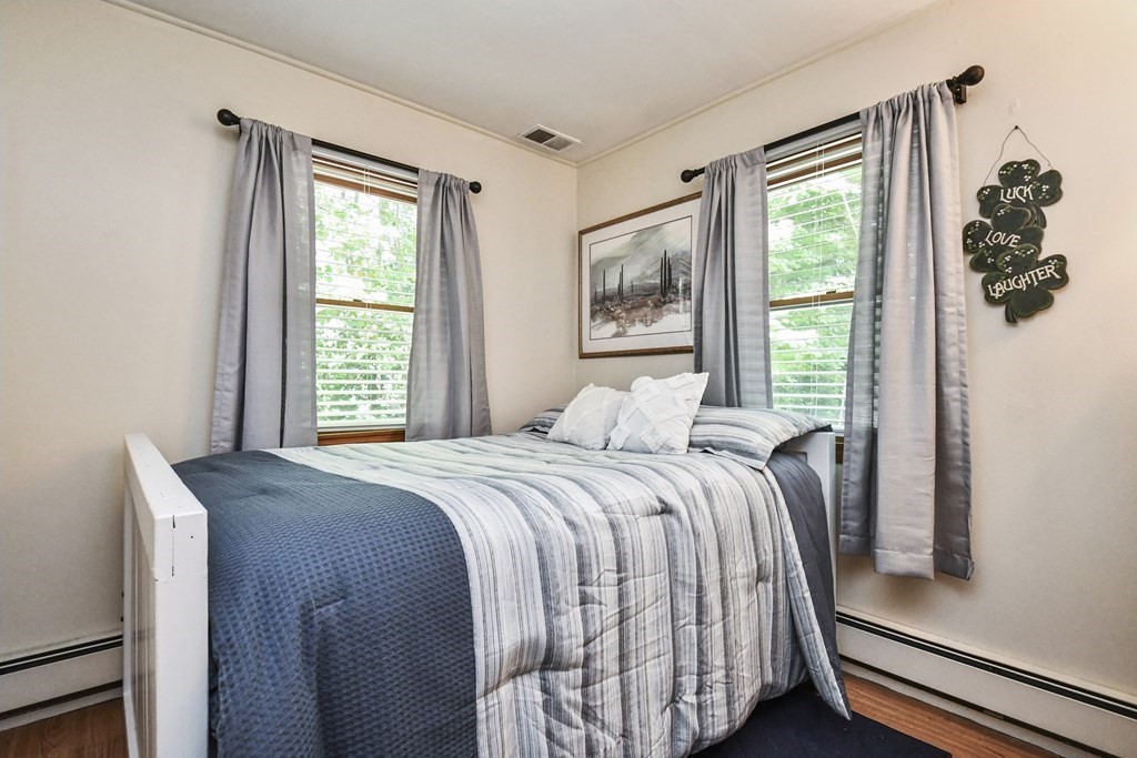 146 South Row Road Lunenburg, MA 01462 - Photo 15 of 32 a bedroom with a bed and a window