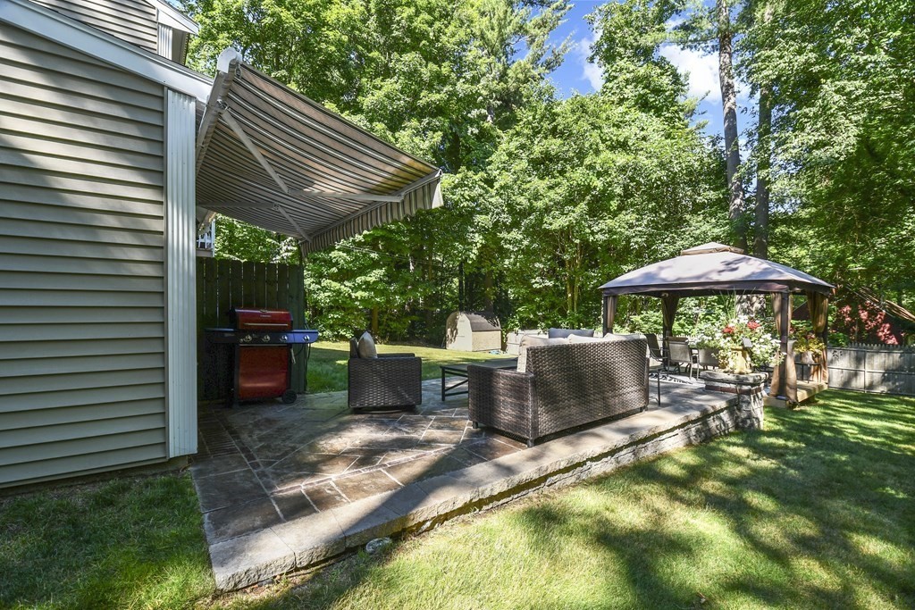 146 South Row Road Lunenburg, MA 01462 - Photo 28 of 32 a backyard of a house with yard and outdoor seating