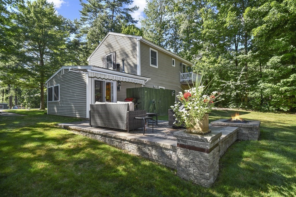 146 South Row Road Lunenburg, MA 01462 - Photo 31 of 32 a view of a house with backyard sitting area and garden