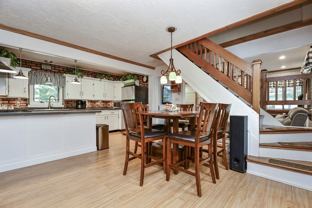 146 South Row Road Lunenburg, MA 01462 - Photo 7 of 32 a dining room with furniture entryway and wooden floor