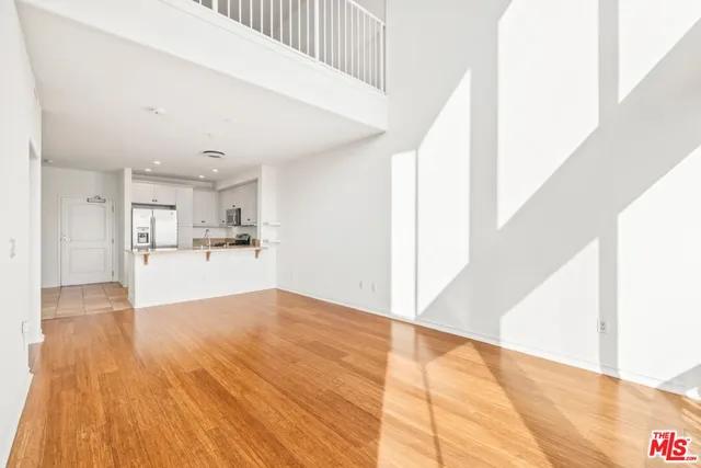 a view of a kitchen with wooden floor