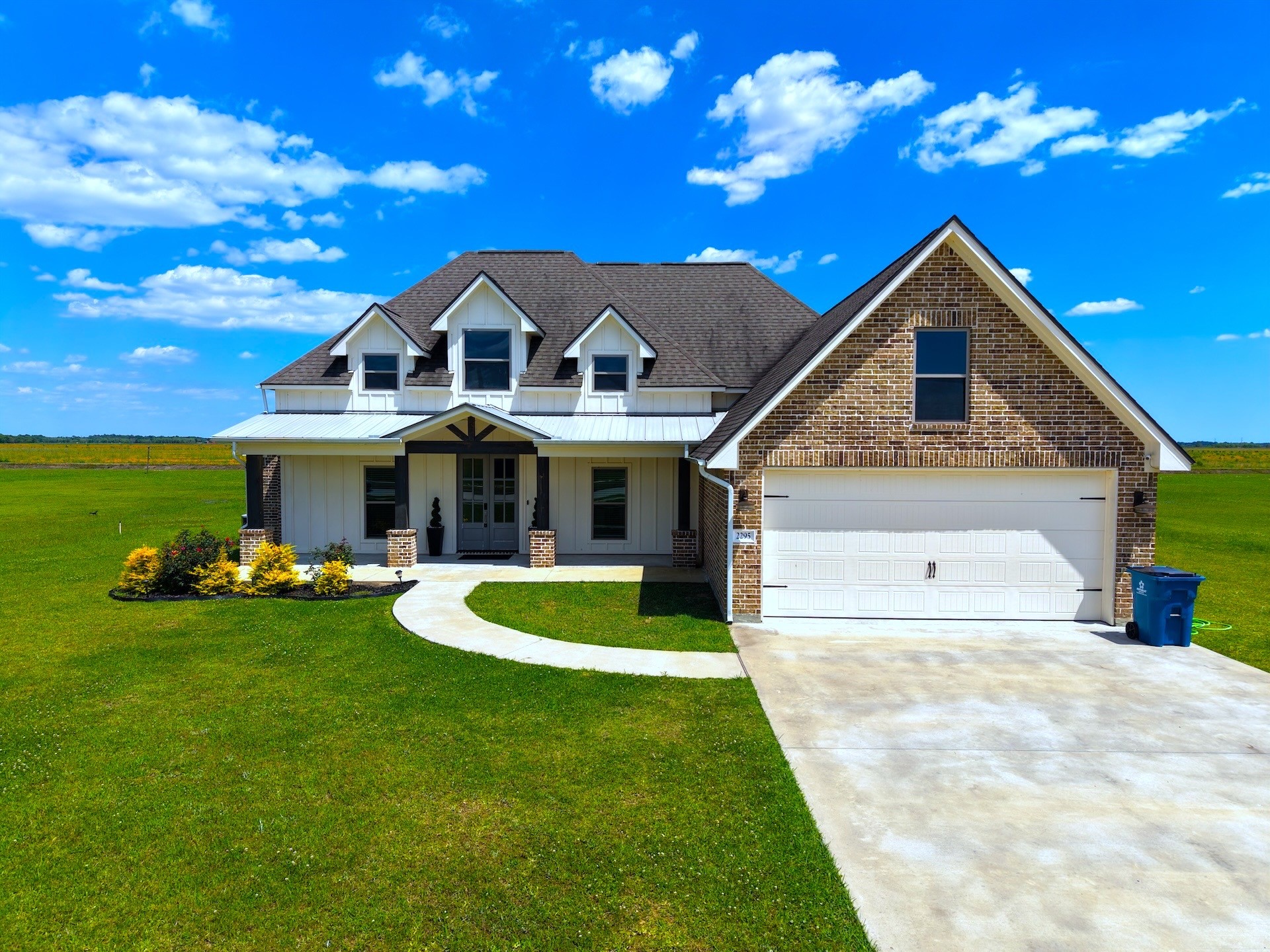 2295 Diamond D Lane Beaumont, TX 77713 - Photo 1 of 40 a front view of a house with garden and porch