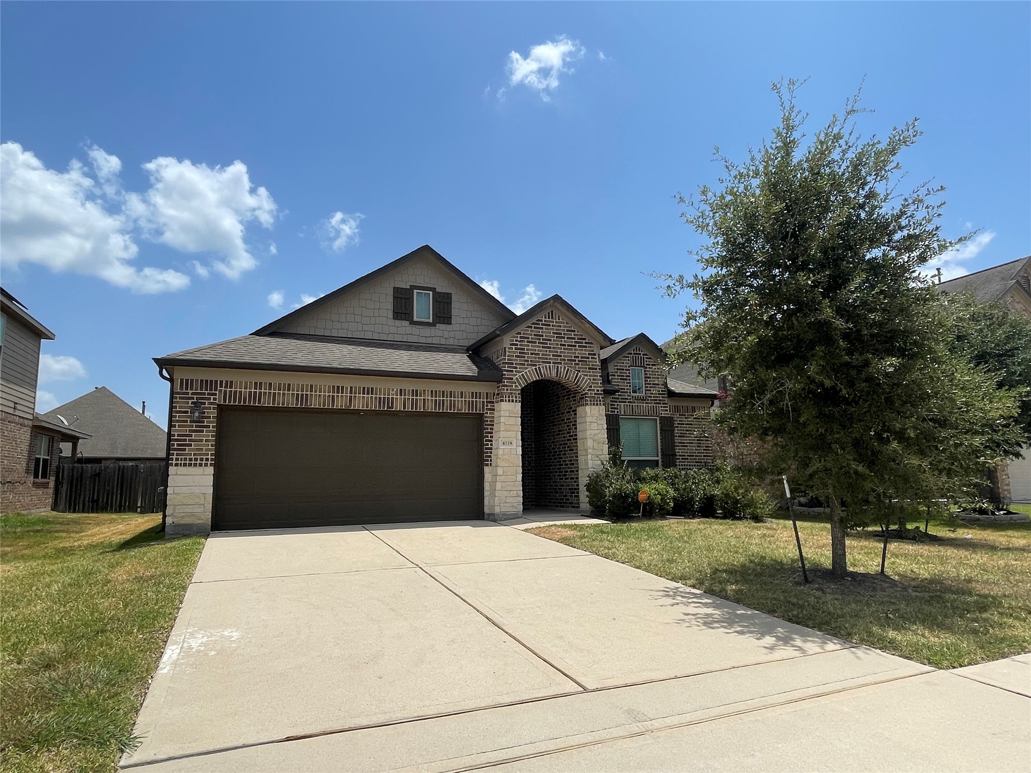 4118 Guild Meadows Drive Houston, TX 77084 - Photo 1 of 35 a front view of a house with a yard