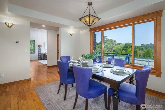 a view of a dining room with furniture window and wooden floor