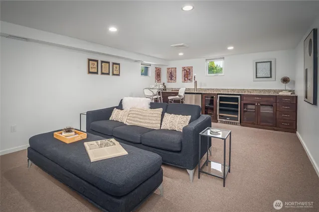 a living room with furniture and kitchen view