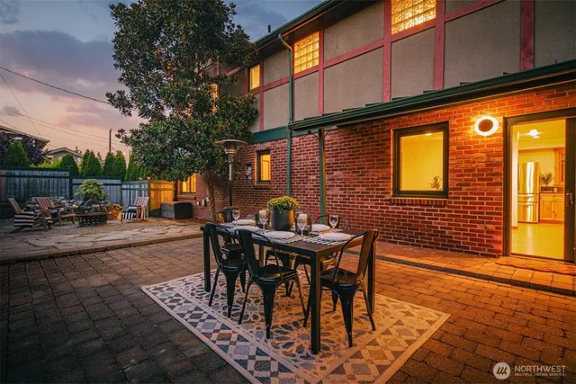 a view of a patio with table and chairs and potted plants