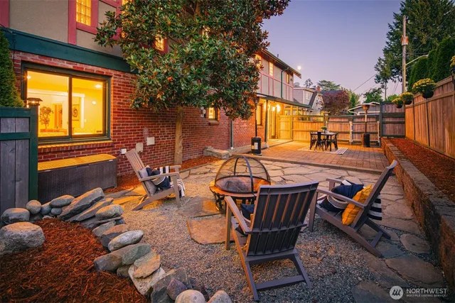 a view of a swimming pool with chair and tables