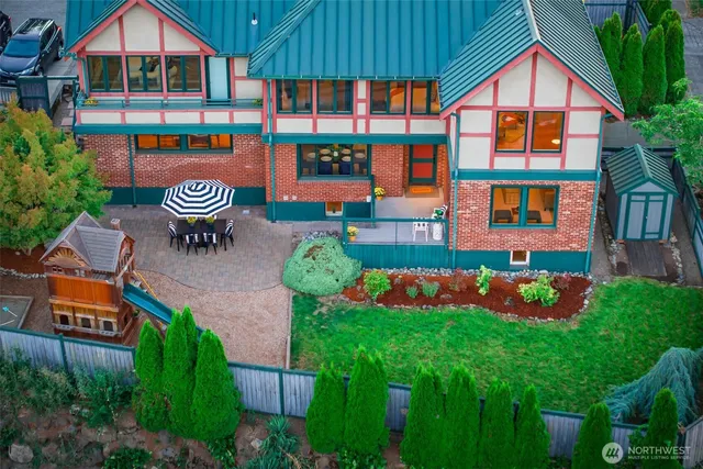 a front view of house with yard and outdoor seating