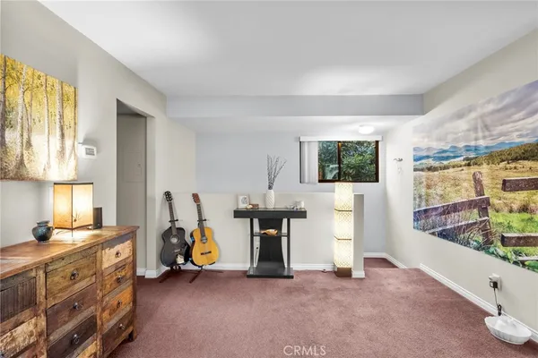 a view of living room with furniture and window