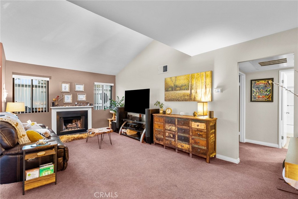 6490 Twin Cir Lane Simi Valley, CA 93063 - Photo 18 of 28 a living room with furniture and a flat screen tv with wooden floor