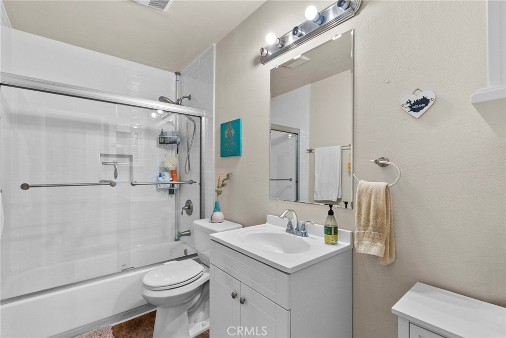 6490 Twin Cir Lane Simi Valley, CA 93063 - Photo 20 of 28 a bathroom with a sink a toilet a mirror and shower