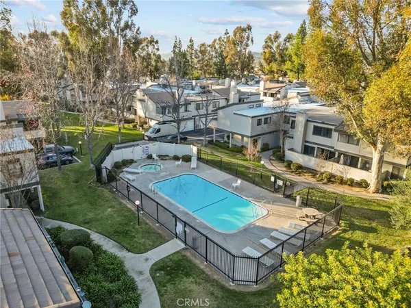 an aerial view of a house with a swimming pool