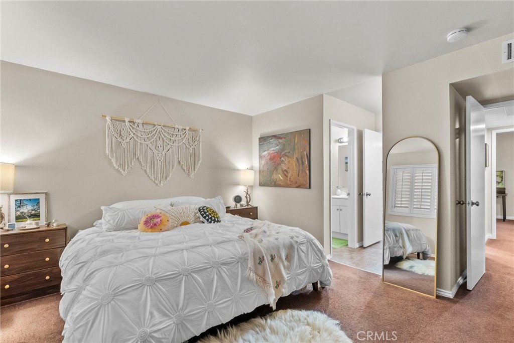 6490 Twin Cir Lane Simi Valley, CA 93063 - Photo 23 of 28 a bedroom with a bed and a painting on the wall