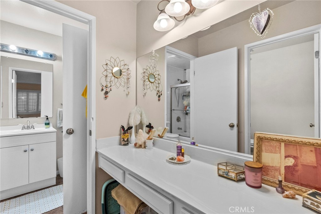 6490 Twin Cir Lane Simi Valley, CA 93063 - Photo 26 of 28 a bathroom with a sink vanity granite and a mirror