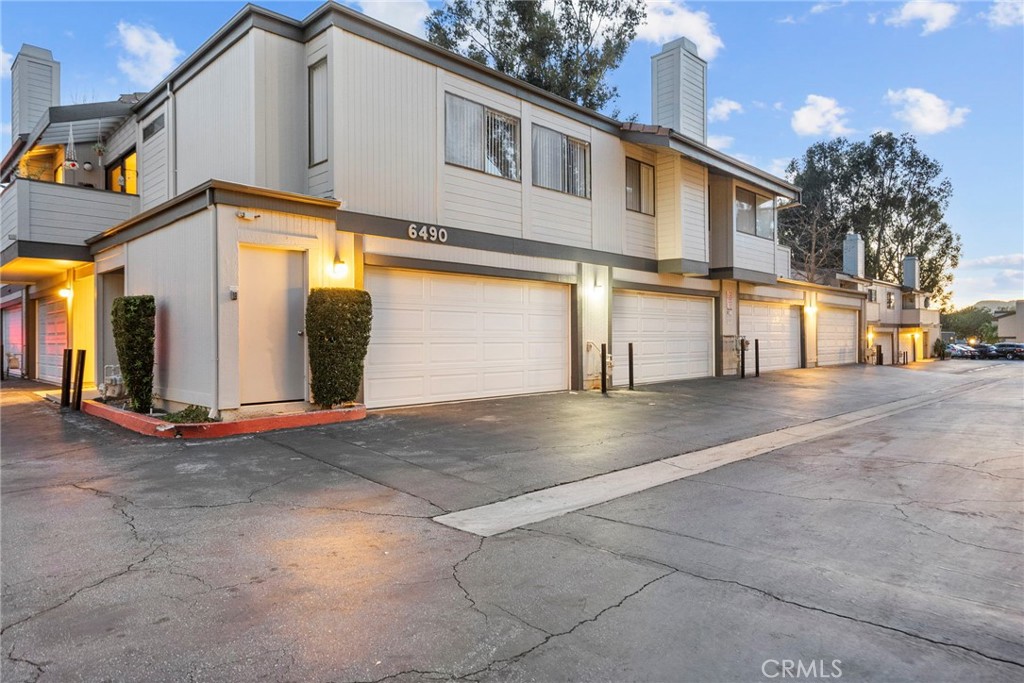 6490 Twin Cir Lane Simi Valley, CA 93063 - Photo 28 of 28 a view of a white house with large windows