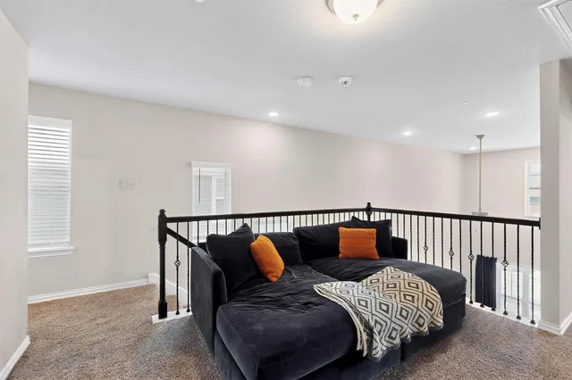 a bedroom with bed and wooden floor