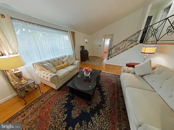 a living room with furniture and a rug