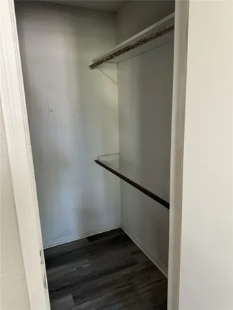 a bathroom with a toilet and bathtub