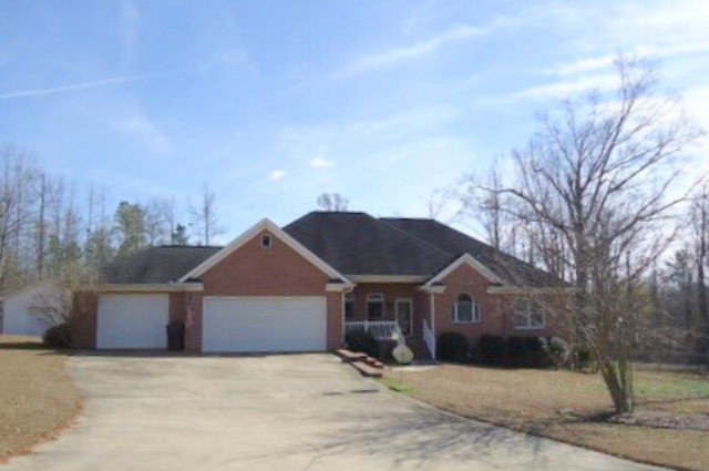 4866 Sandy Point Road Lizella, GA 31052 - Photo 1 of 1 a front view of a house with a yard