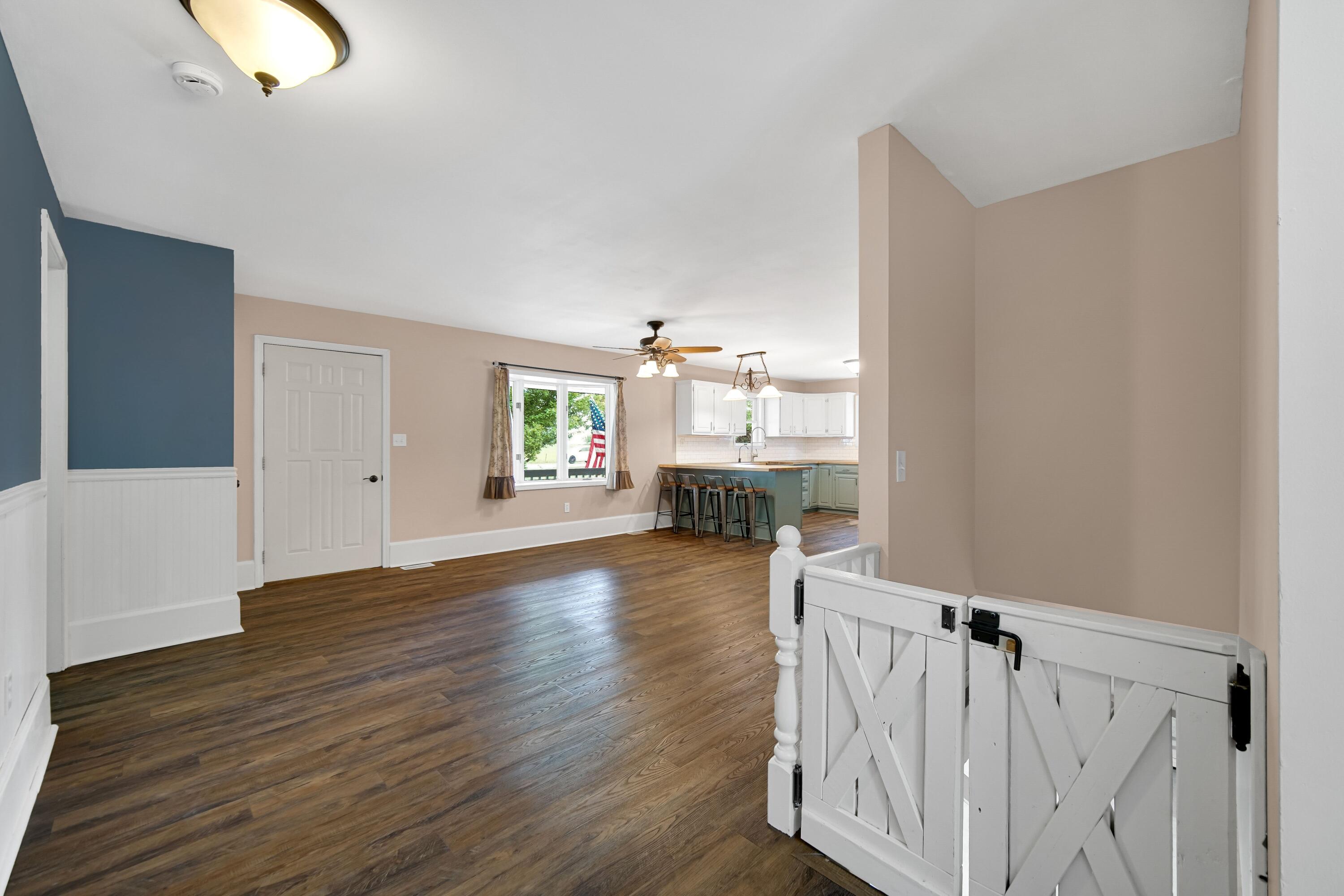 476 Highway 2 Hebron, IN 46341 - Photo 11 of 25 a view of a hallway with wooden floor and staircase