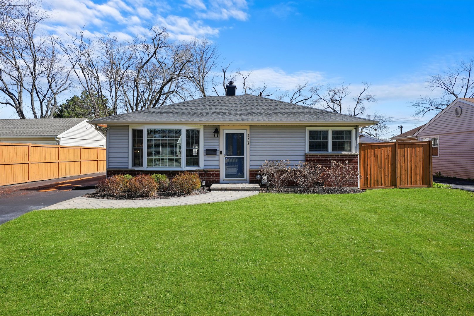 a view of a house with a yard and a garden